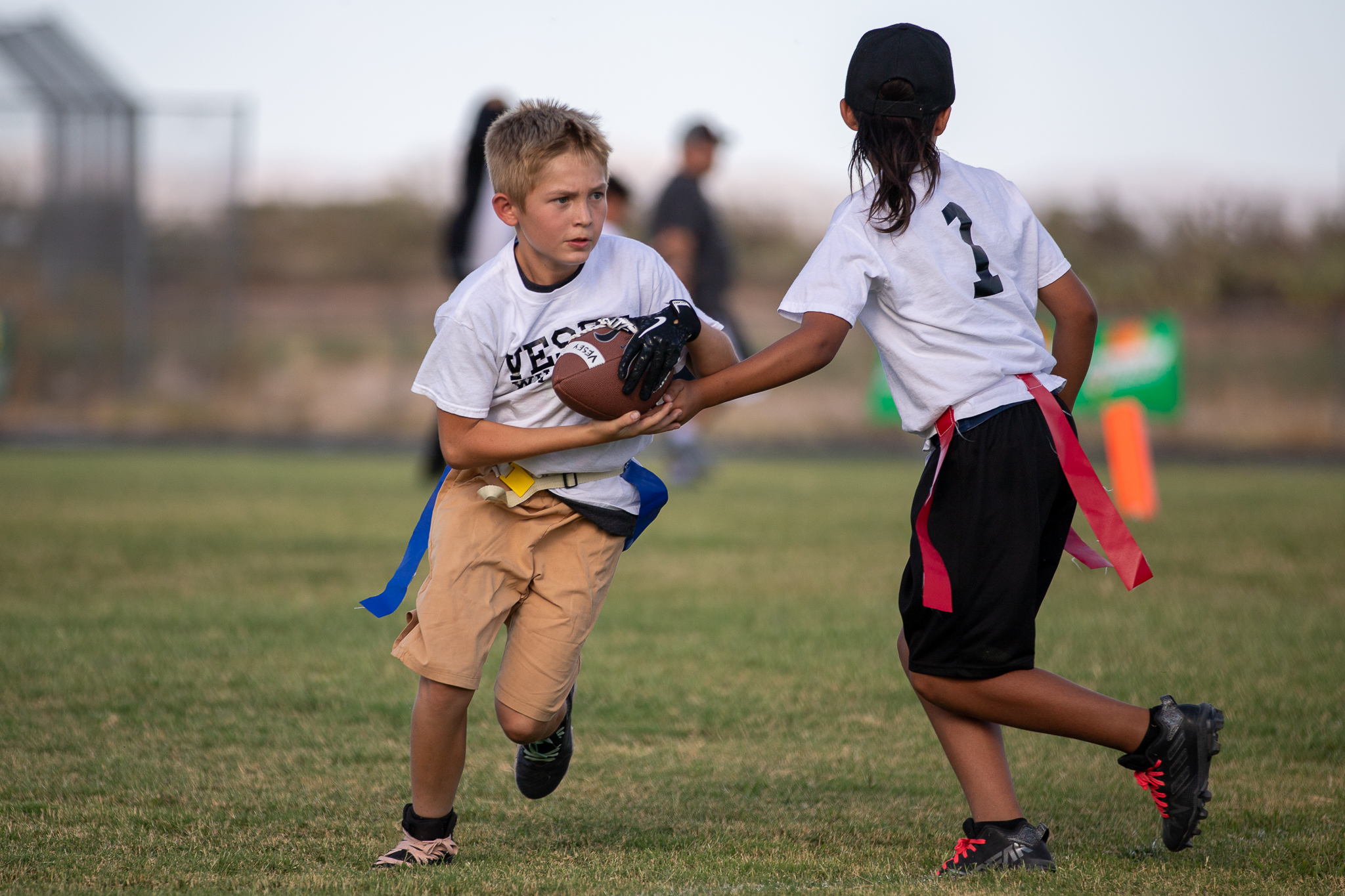 A Vesey player takes the ball from his teammate