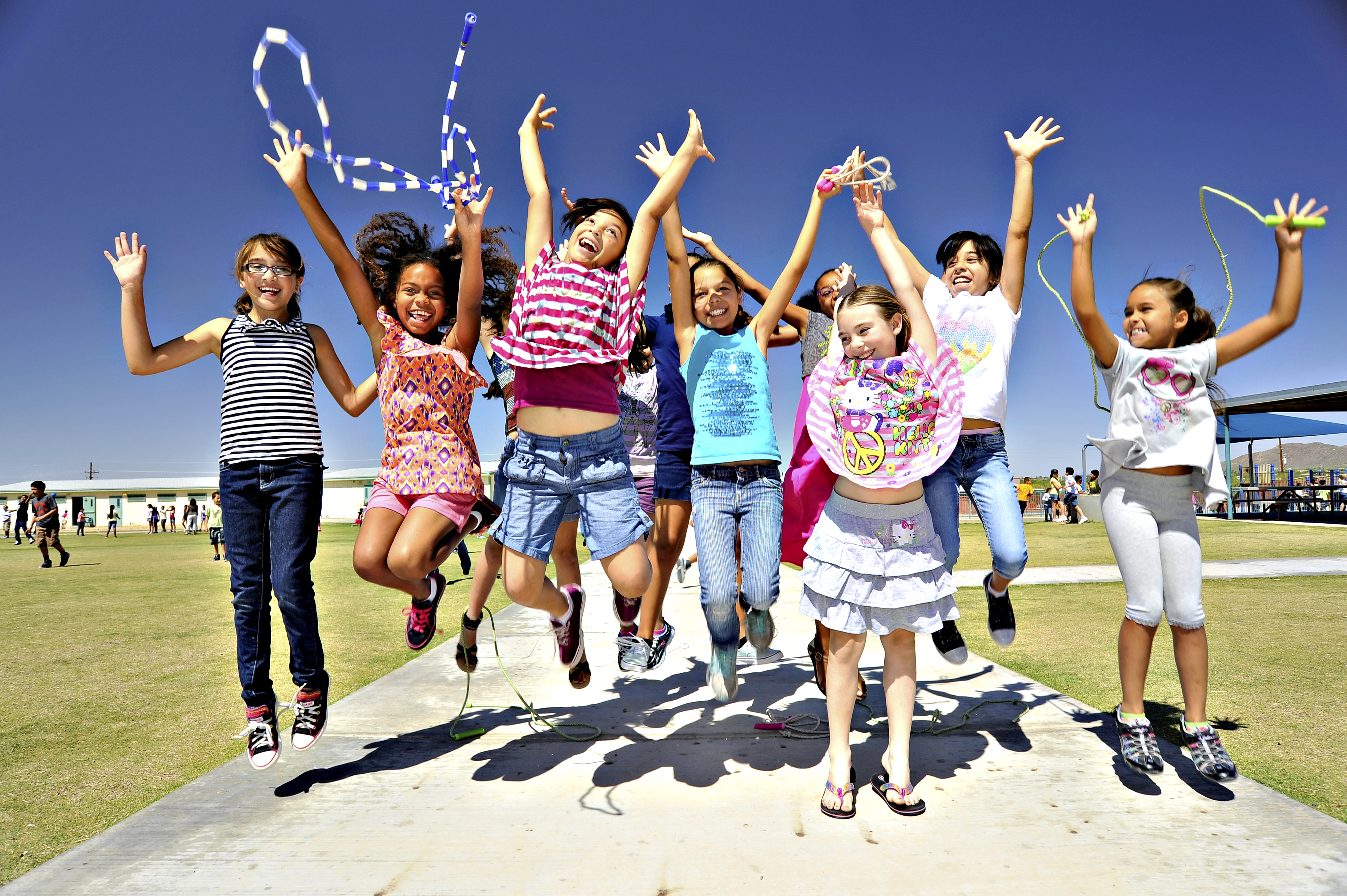 A group of students jump for joy at recess!